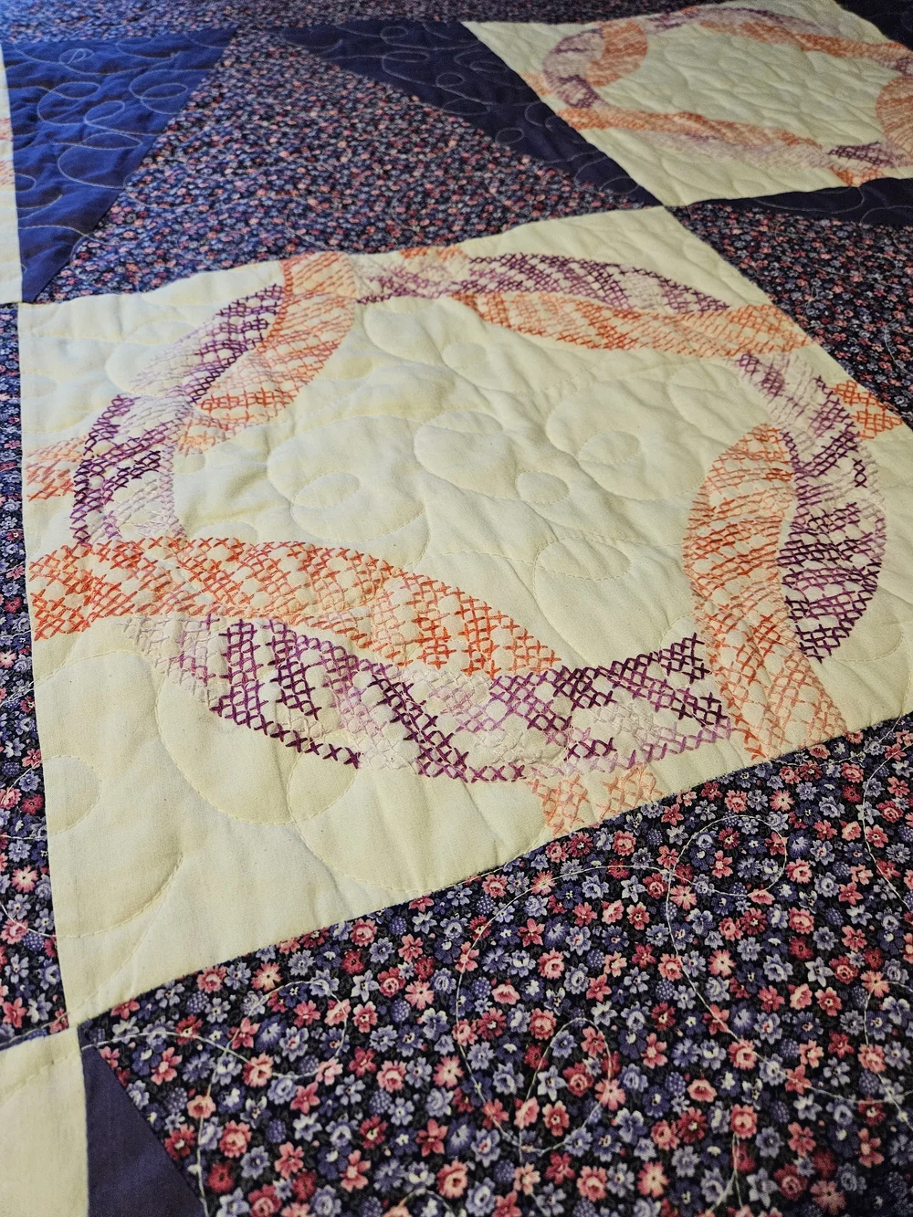 Homemade Purple Patchwork Quilt With Cross-stitch Detail